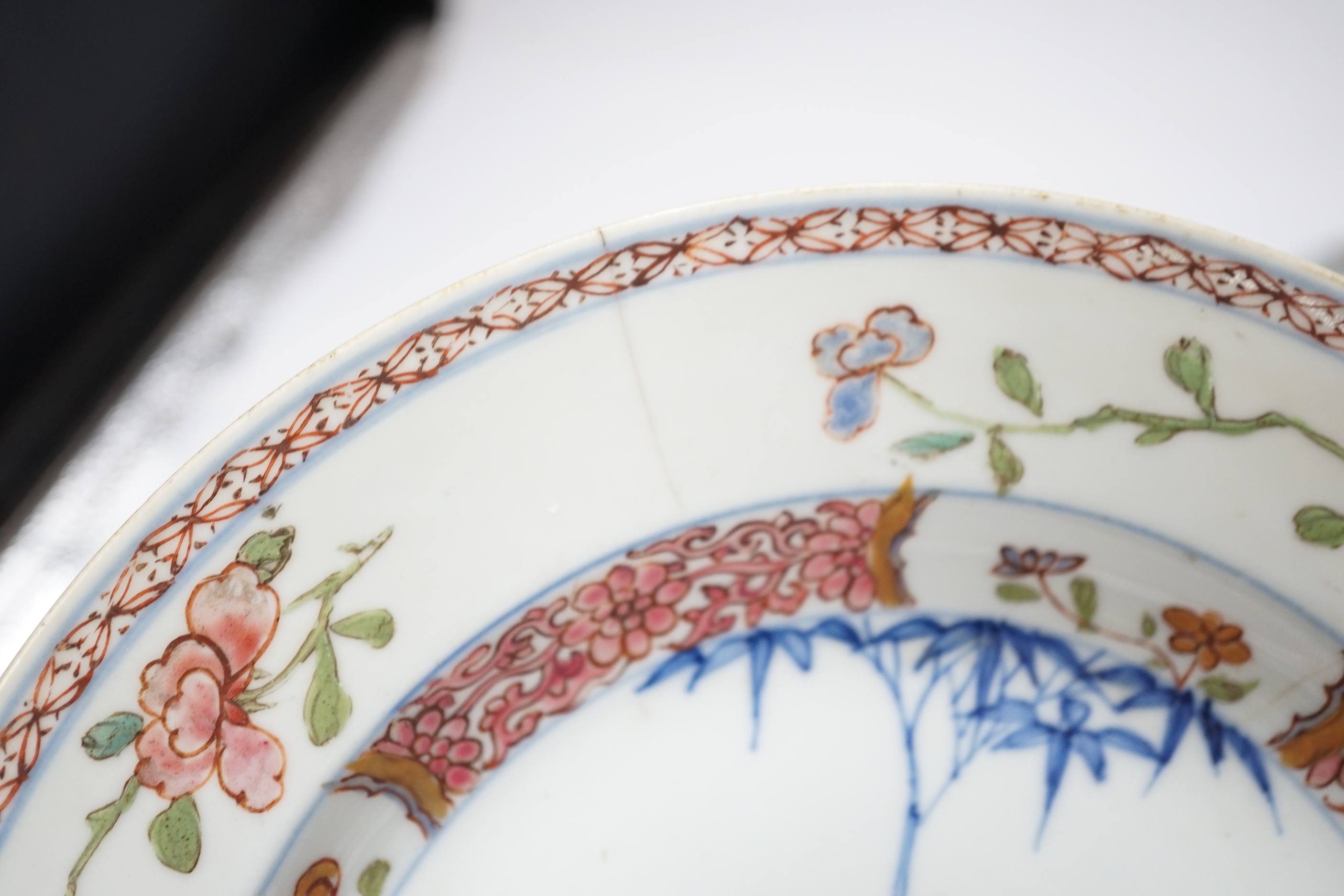 A collection of 18th century Chinese export plates and saucers